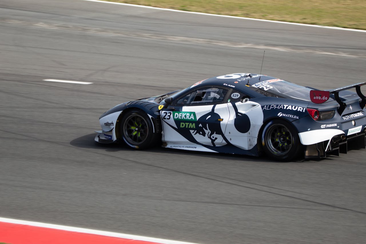 Dynamic sports car speeding on a race track during a tournament.